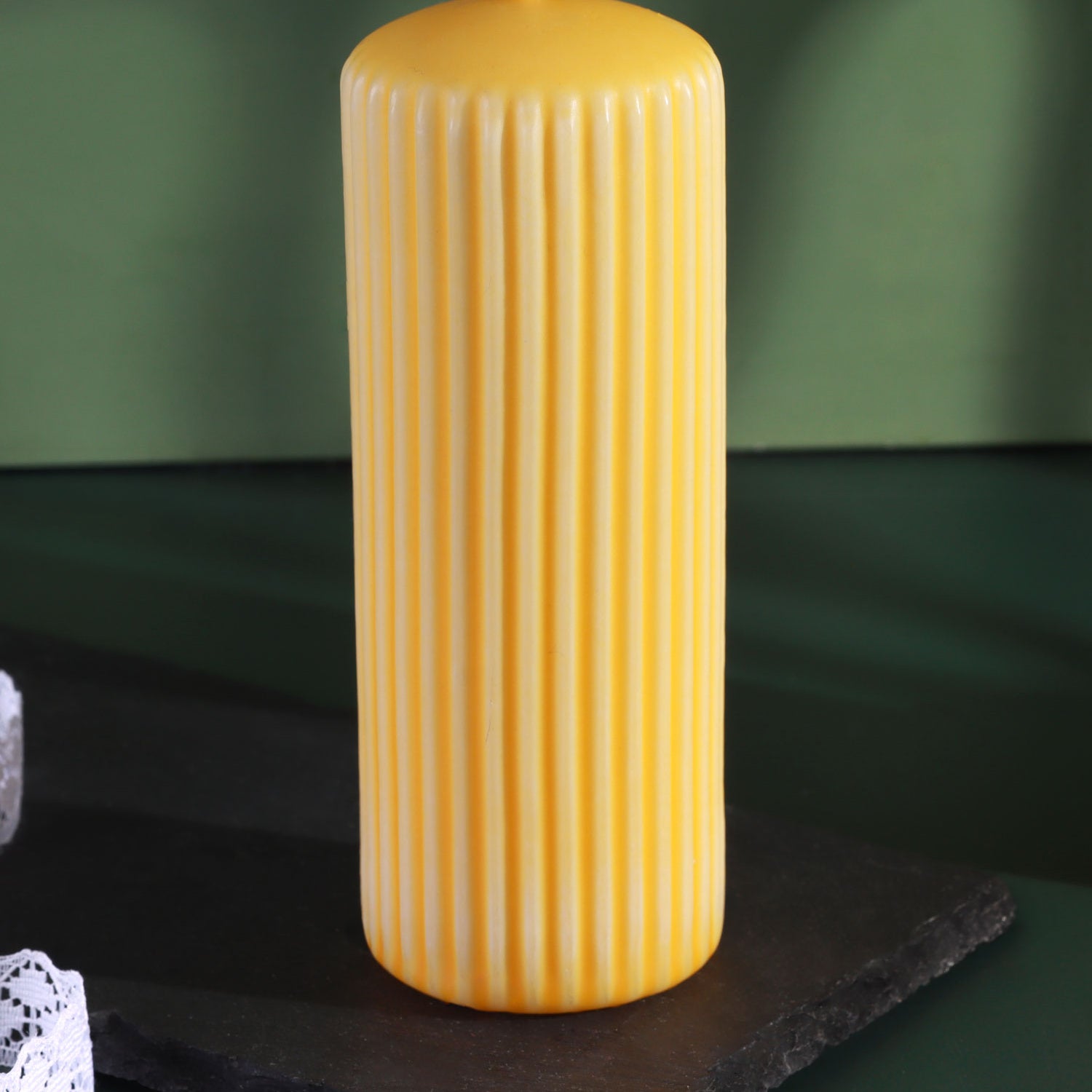 Velluto Sculpted Daffodil Yellow Ribbed Pillar Candle in a Velvet Matte Finish