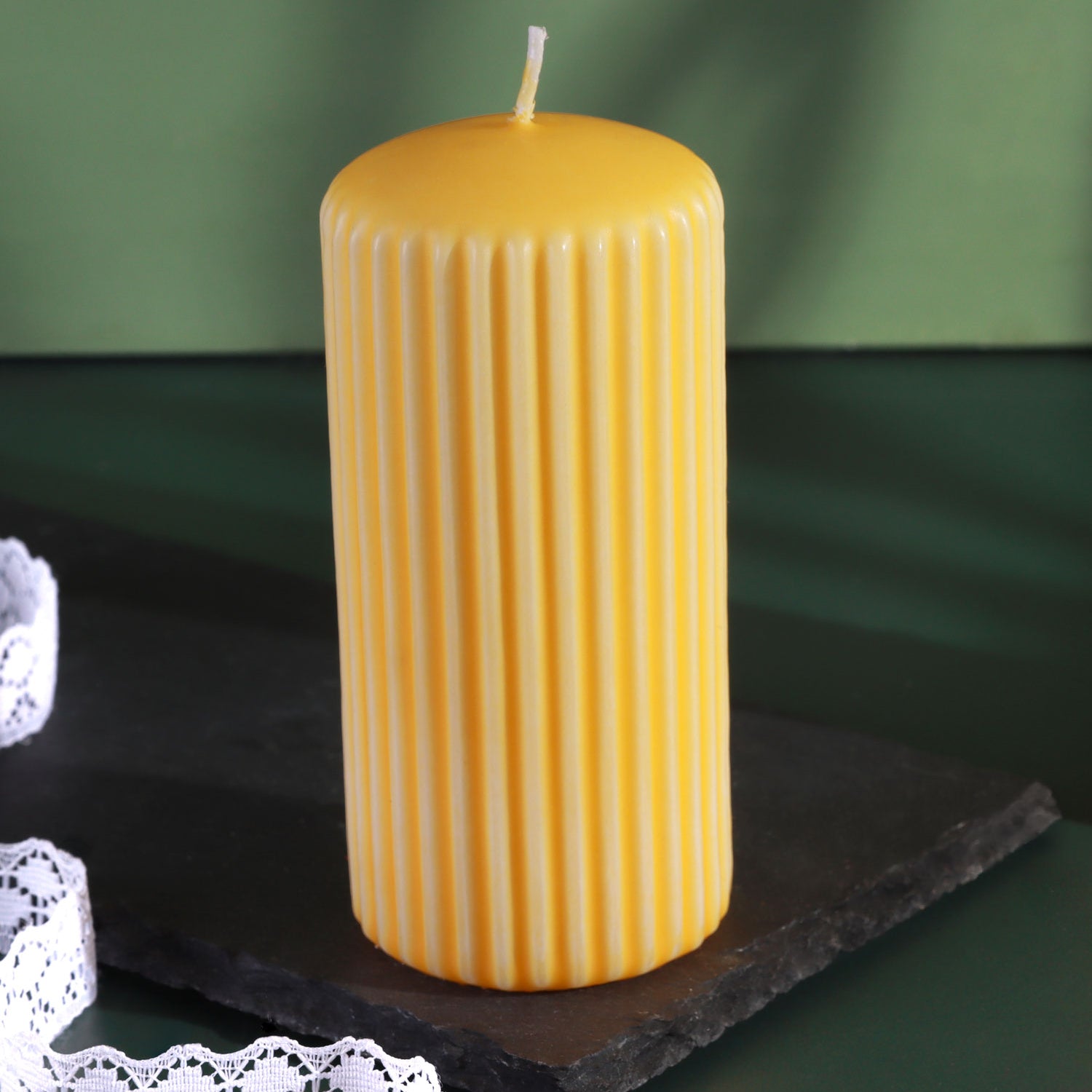 Velluto Sculpted Daffodil Yellow Ribbed Pillar Candle in a Velvet Matte Finish