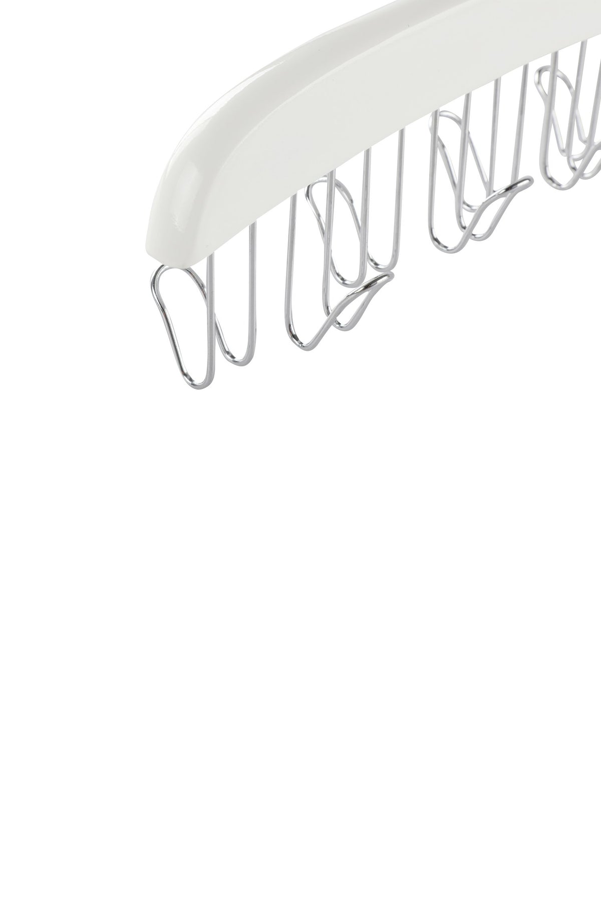 Close-up of the metal hooks under the white wooden belt hanger