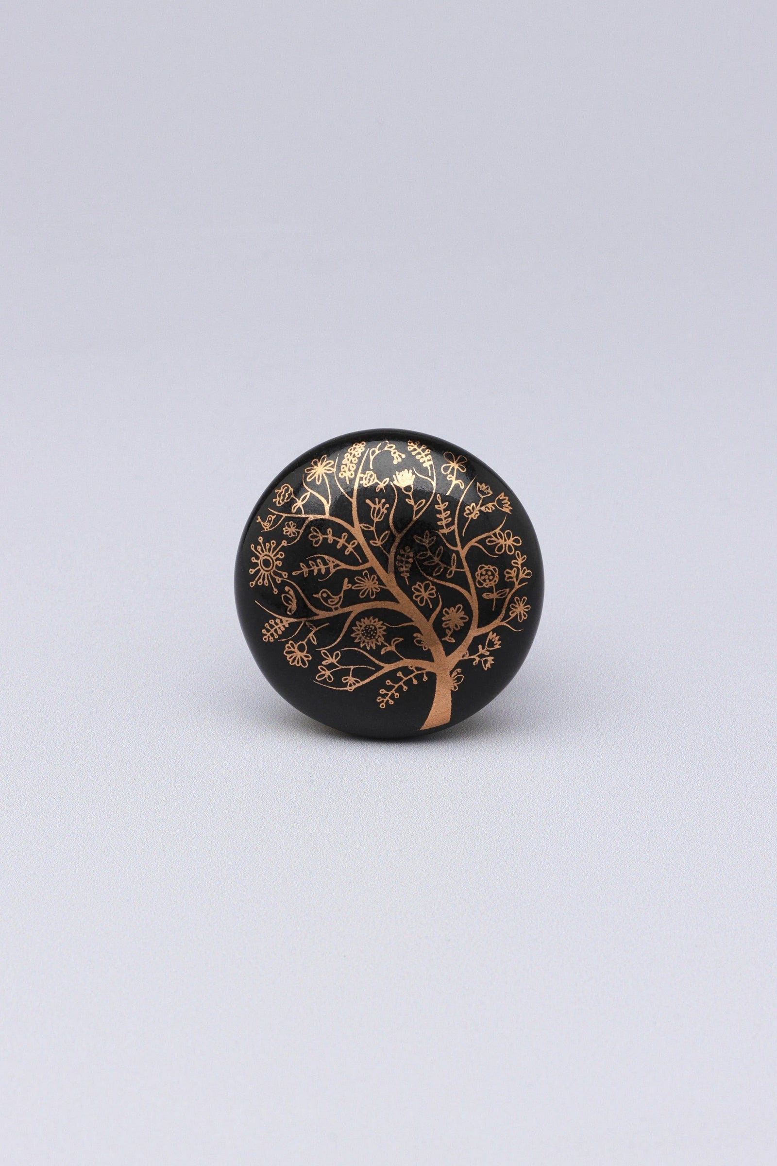 Eternal Bloom Tree of Life Ceramic Cabinet Knob in Black and Gold — close-up view, G Decor