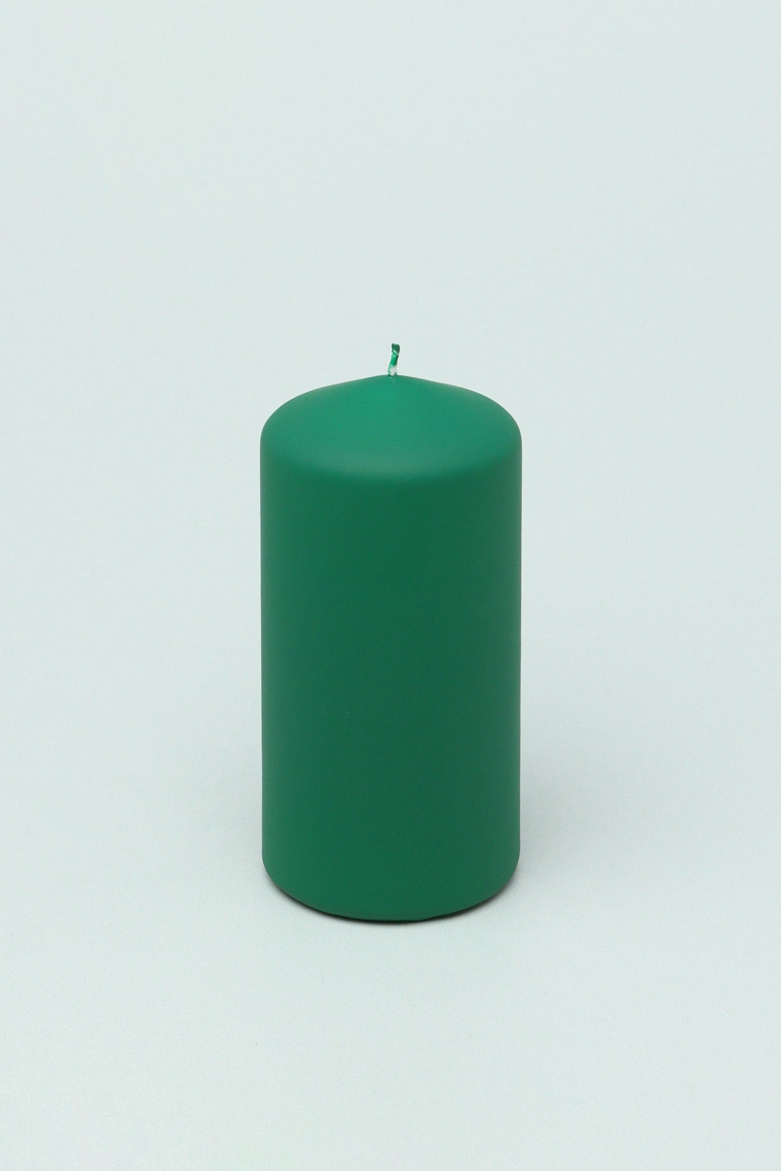 Henry Velvet Matte Soft Touch Pillar Candle in Emerald Green — close-up view, G Decor