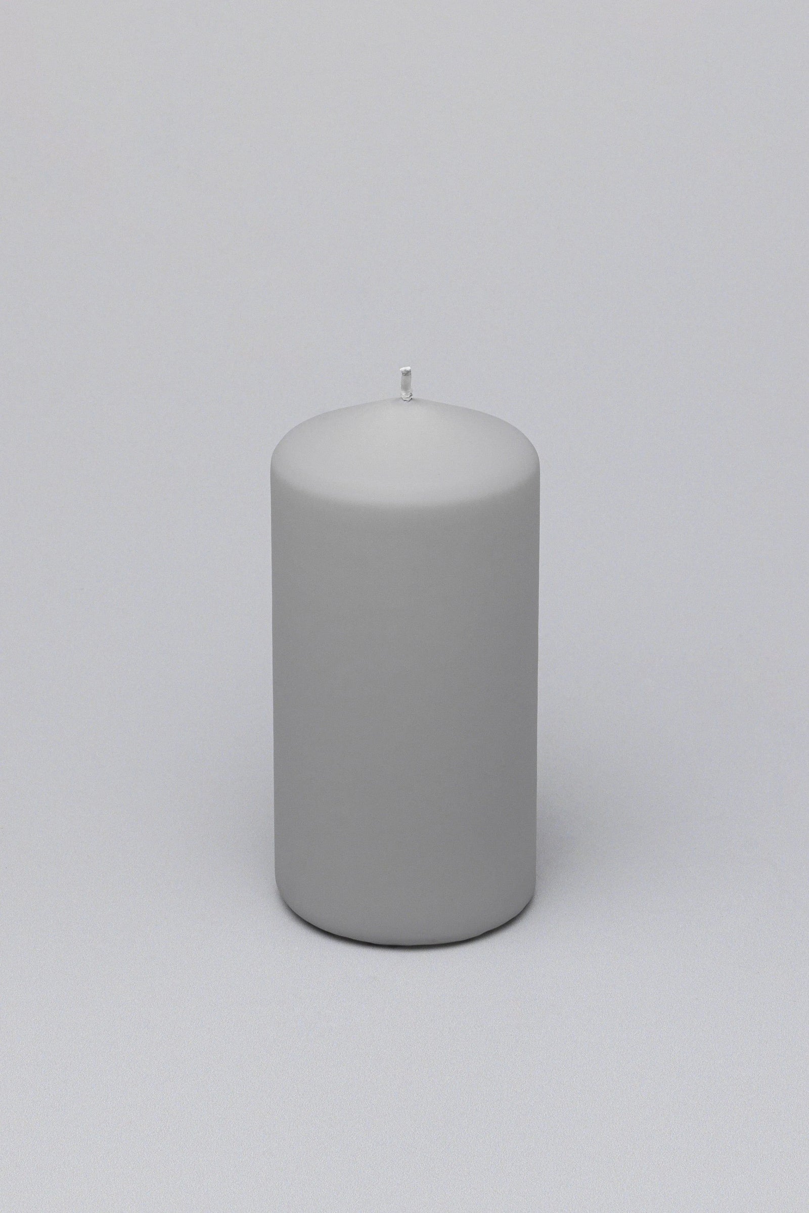 Henry Velvet Matte Soft Touch Pillar Candle in Light Grey — close-up view, G Decor