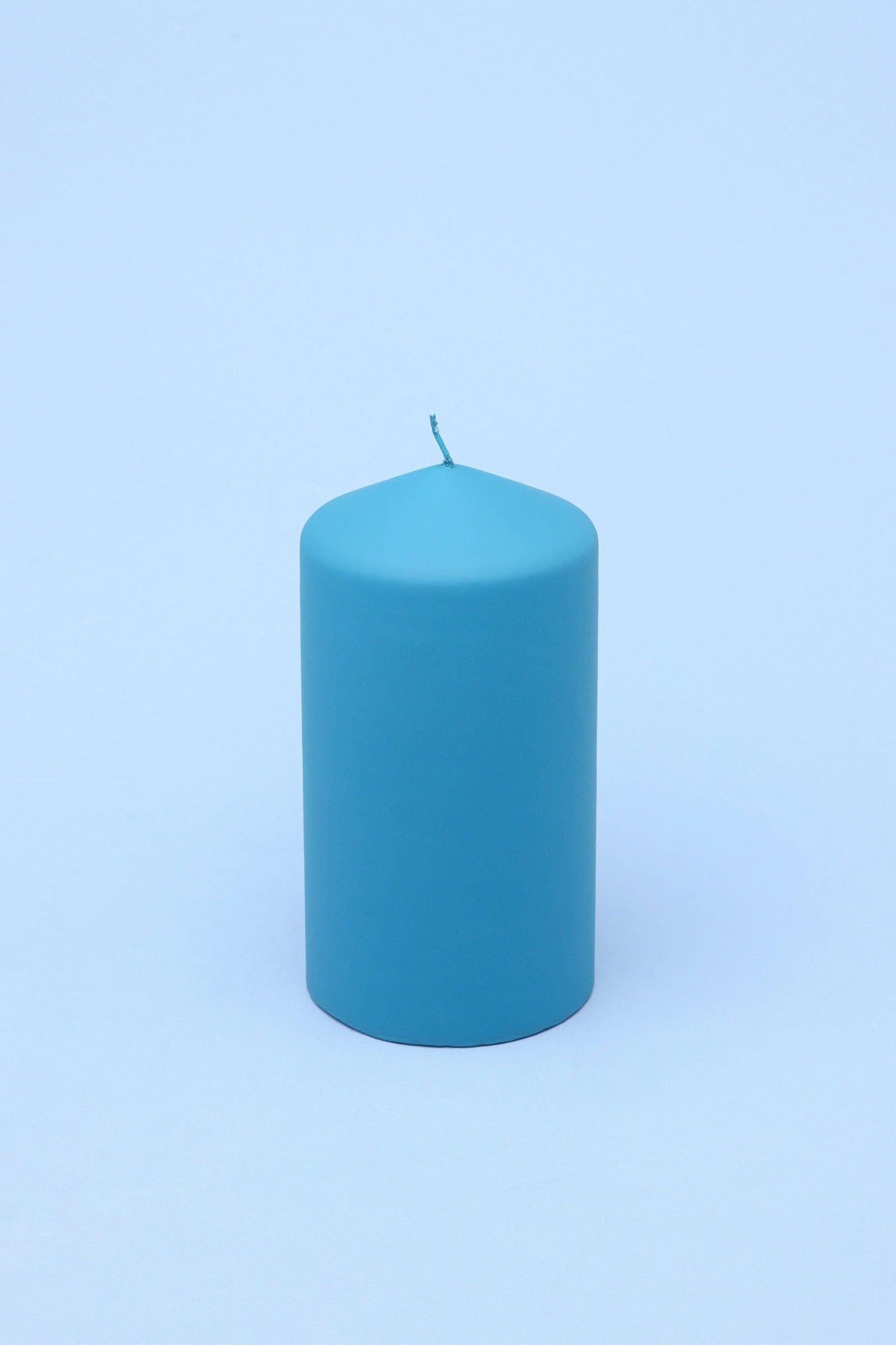 Henry Velvet Matte Soft Touch Pillar Candle in Powder Blue — lifestyle view, G Decor