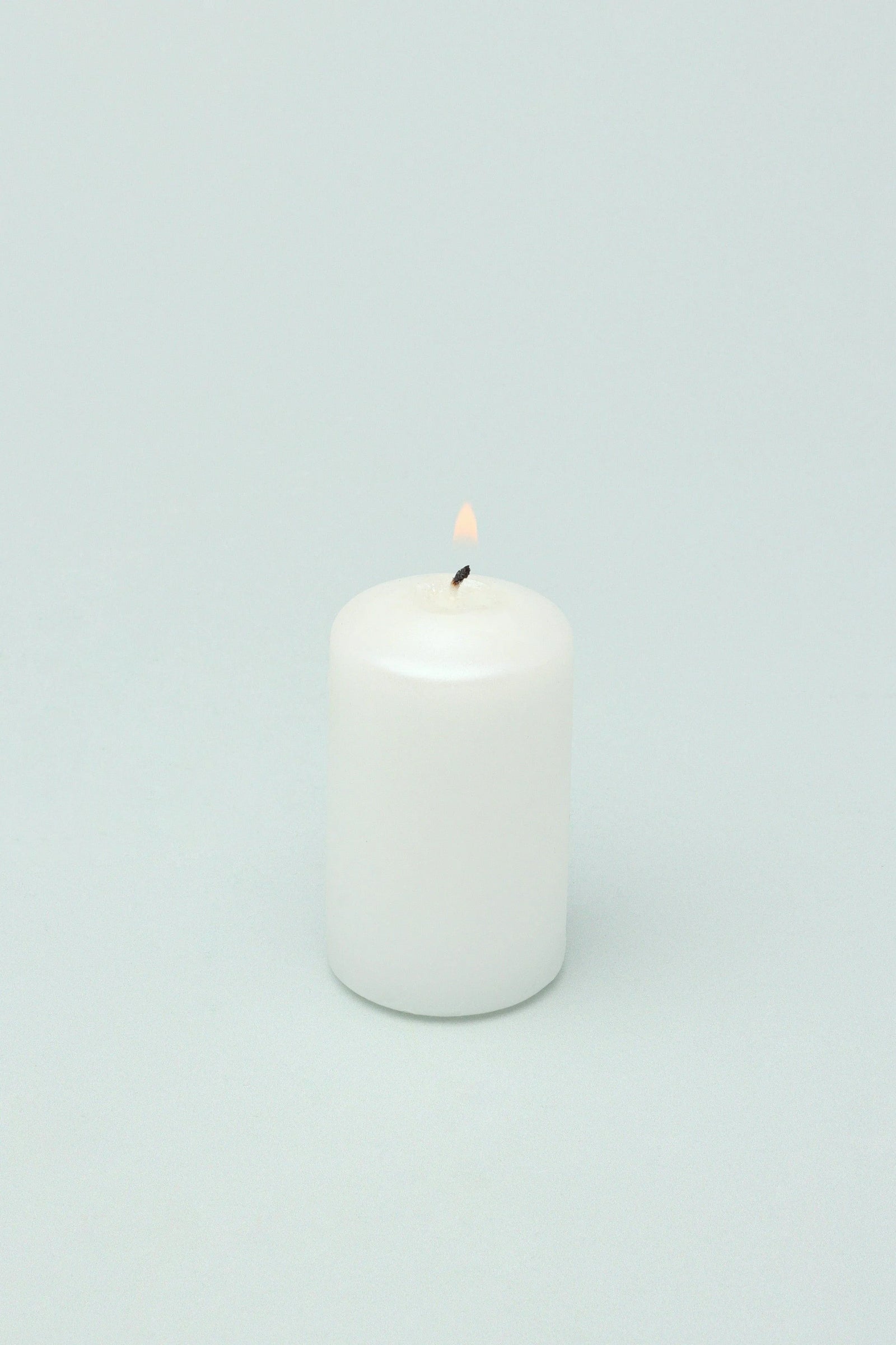 Soft White Satin-Coated Pillar Candles Set of 4 — close-up view, G Decor