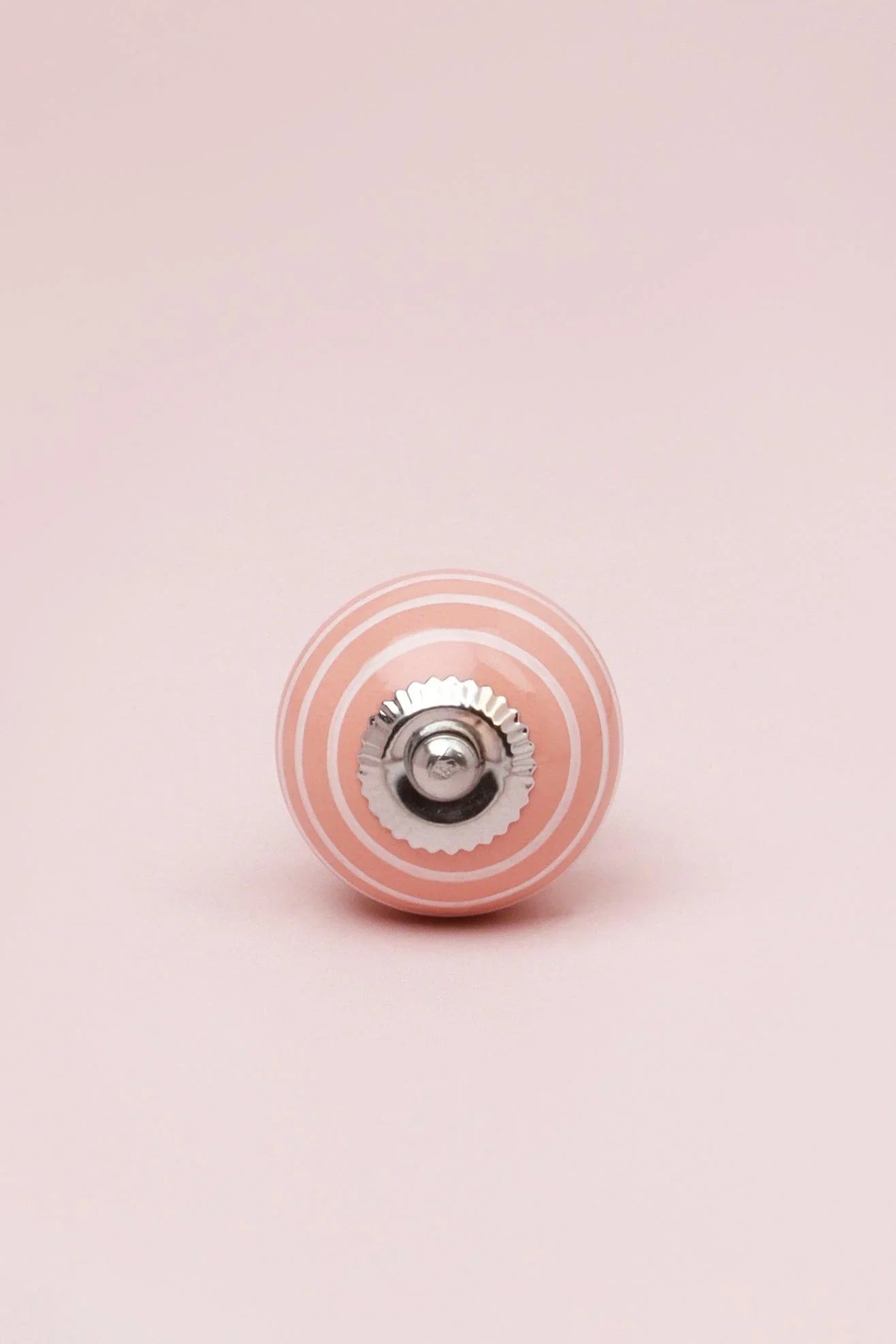 White Striped Ceramic Cabinet Knob in Pastel Pink and Yellow — close-up view, G Decor