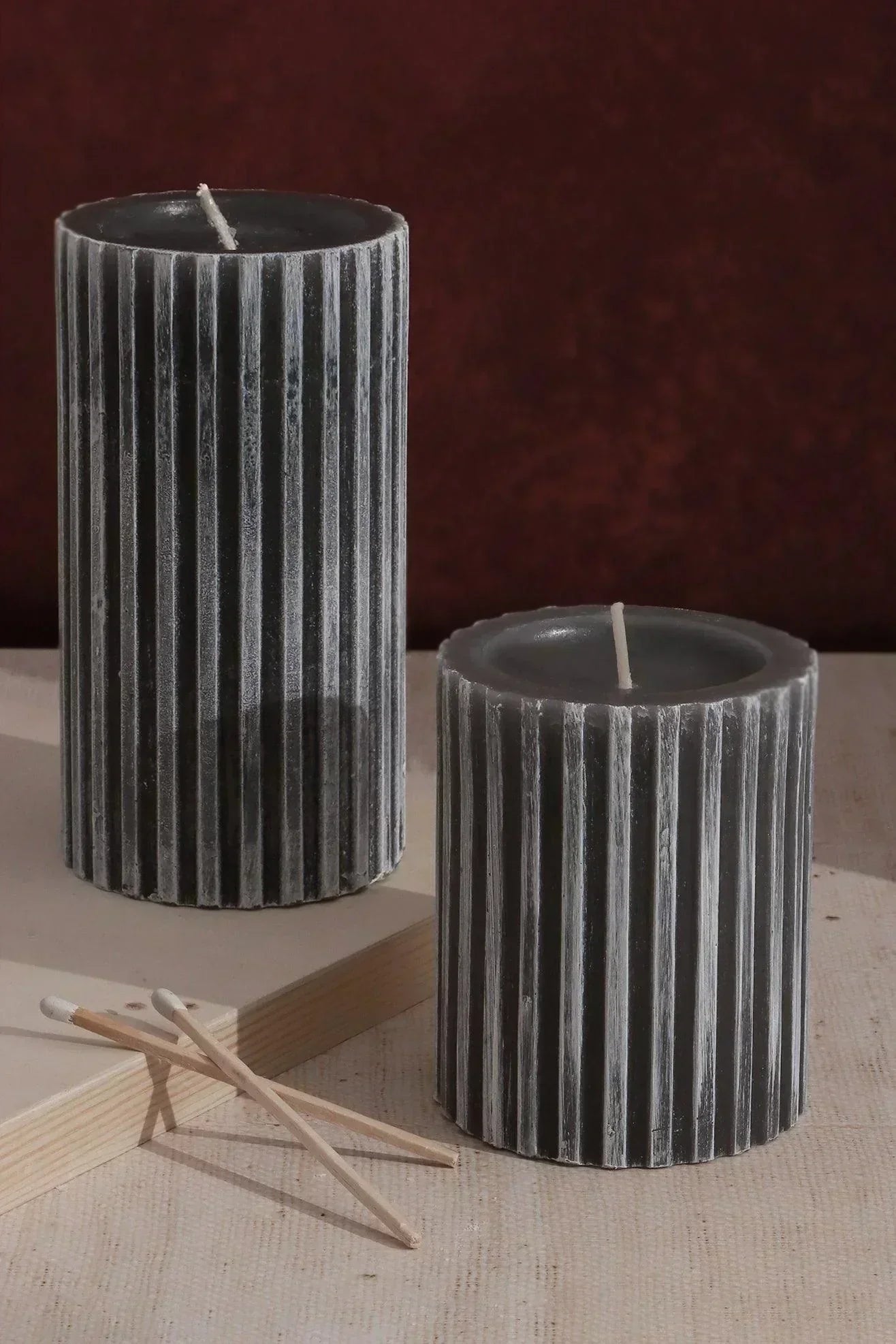 A guide to scented candles — Textured Harmony grooved pillar candle in dark grey, a quiet woody presence | G Decor