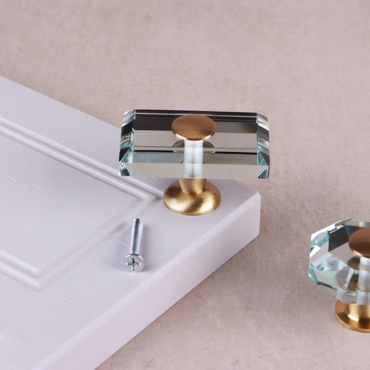 Rectangle clear crystal glass cabinet knob, 50 x 32mm, on a satin brass base