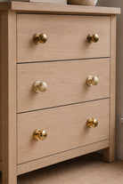Bun cabinet knobs grouped, showing the low dome and stepped rose