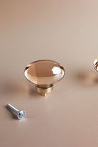 Oval champagne crystal glass cabinet knob, 45mm, on a satin brass base