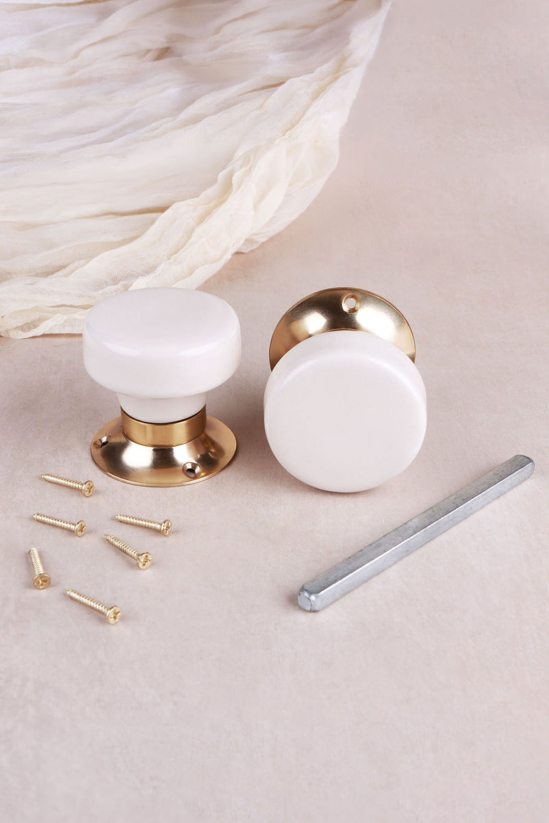 Cream Ceramic Mortice Door Knobs with Polished Brass Roses