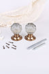 Pair of clear crystal faceted glass mortice door knobs on antique brass roses, with the square spindles and fixing screws