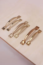 Cupboard pull handles in polished, aged and satin brass, both sizes