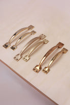 Cupboard pull handles in polished, aged and satin brass, both sizes
