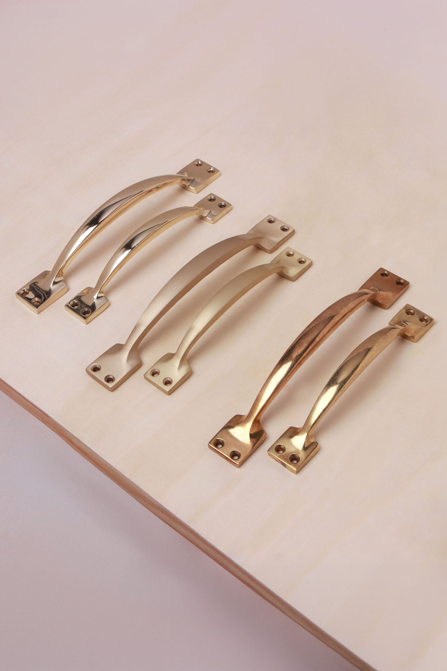 Cupboard pull handles in polished, aged and satin brass, both sizes