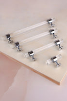 Crystal bar pull handle collection on a neutral background
