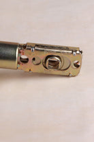 Latch body stamped 60mm and 70mm, showing the adjustable backset and 8mm spindle hole