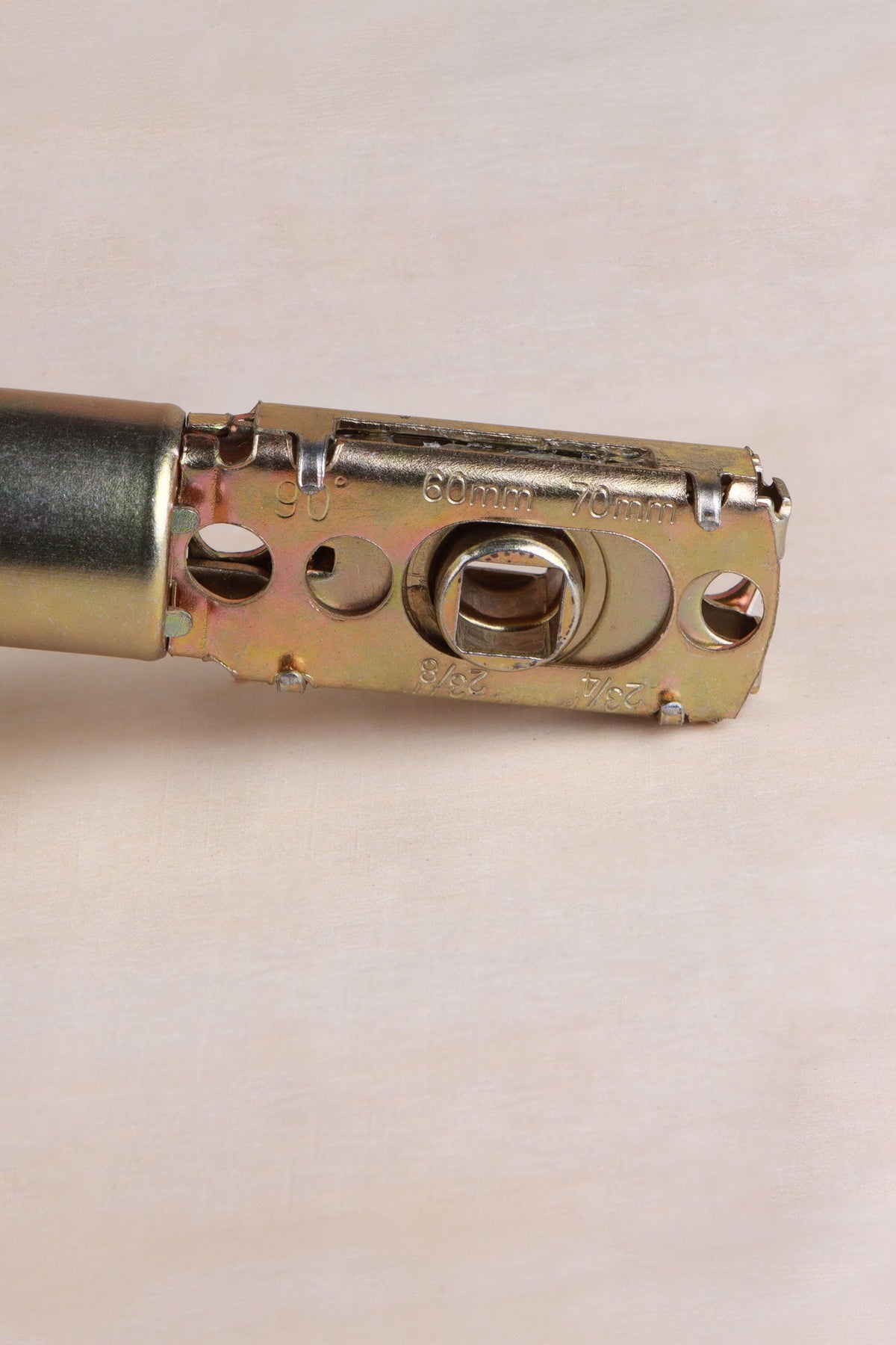 Latch body stamped 60mm and 70mm, showing the adjustable backset and 8mm spindle hole