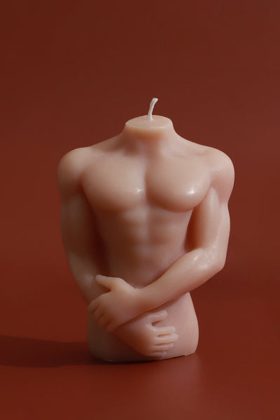 Muscular Male Torso and Crouching Female Candles