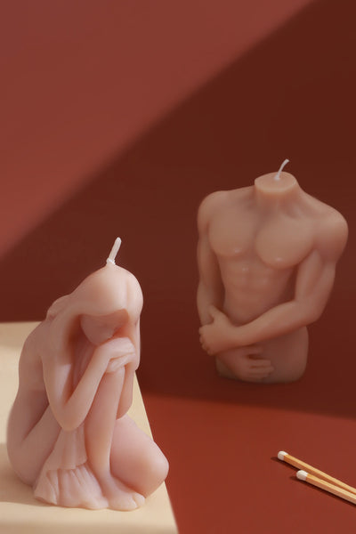 Muscular Male Torso and Crouching Female Candles