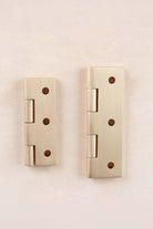 Satin brass cupboard butt hinge fitted to a cabinet door