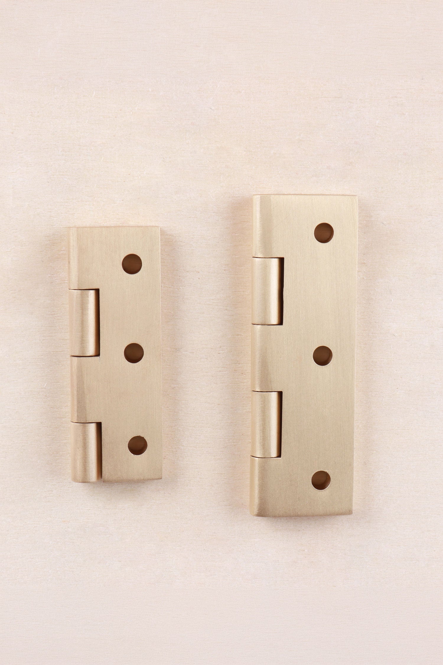 Satin brass cupboard butt hinge fitted to a cabinet door
