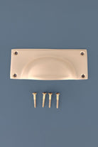 Rounded Plate cup pull in satin brass, lacquered finish