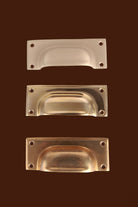 Three finishes of the Square Plate cup pull side by side