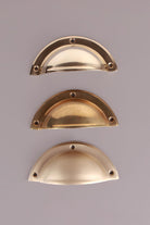 Three finishes of the Half Moon cup pull side by side