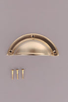 Half Moon cup pull in polished brass, unlacquered living finish