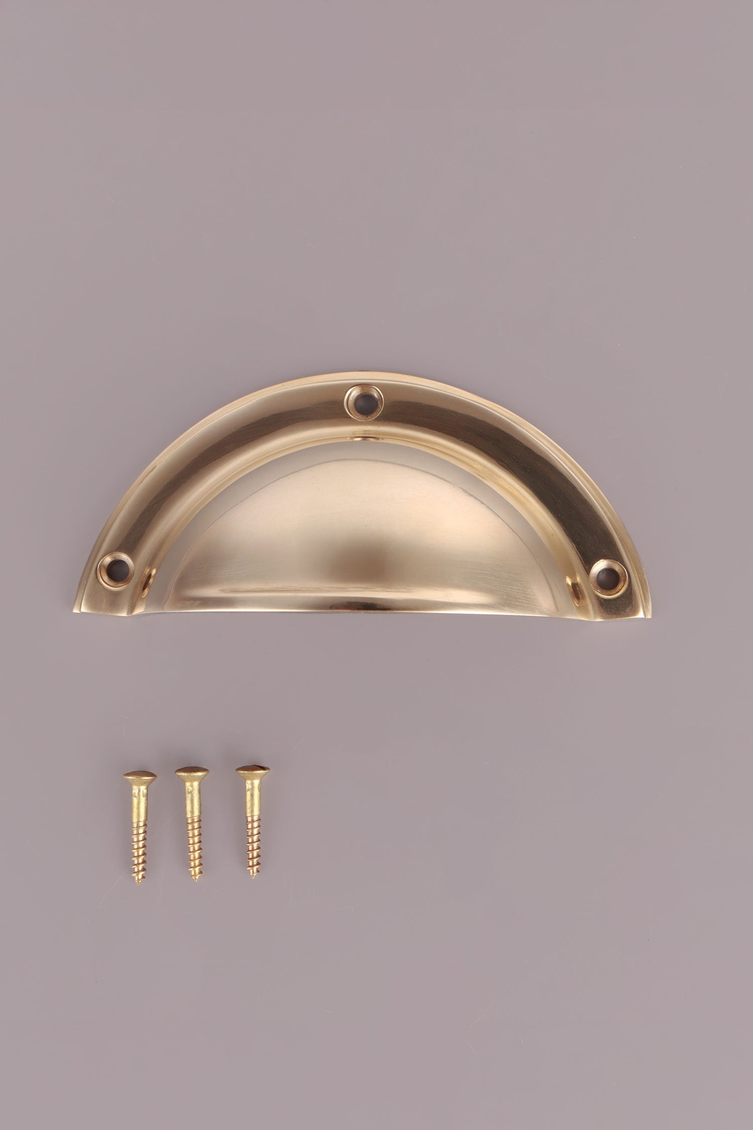 Half Moon cup pull in polished brass, unlacquered living finish