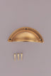 Half Moon cup pull in aged brass, unlacquered living finish