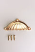 Scalloped cup pull in polished brass, unlacquered living finish