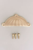 Scalloped cup pull in satin brass, lacquered finish