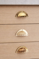 Three finishes of the Fluted cup pull side by side