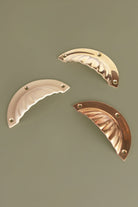 Fluted cup pulls on a drawer front