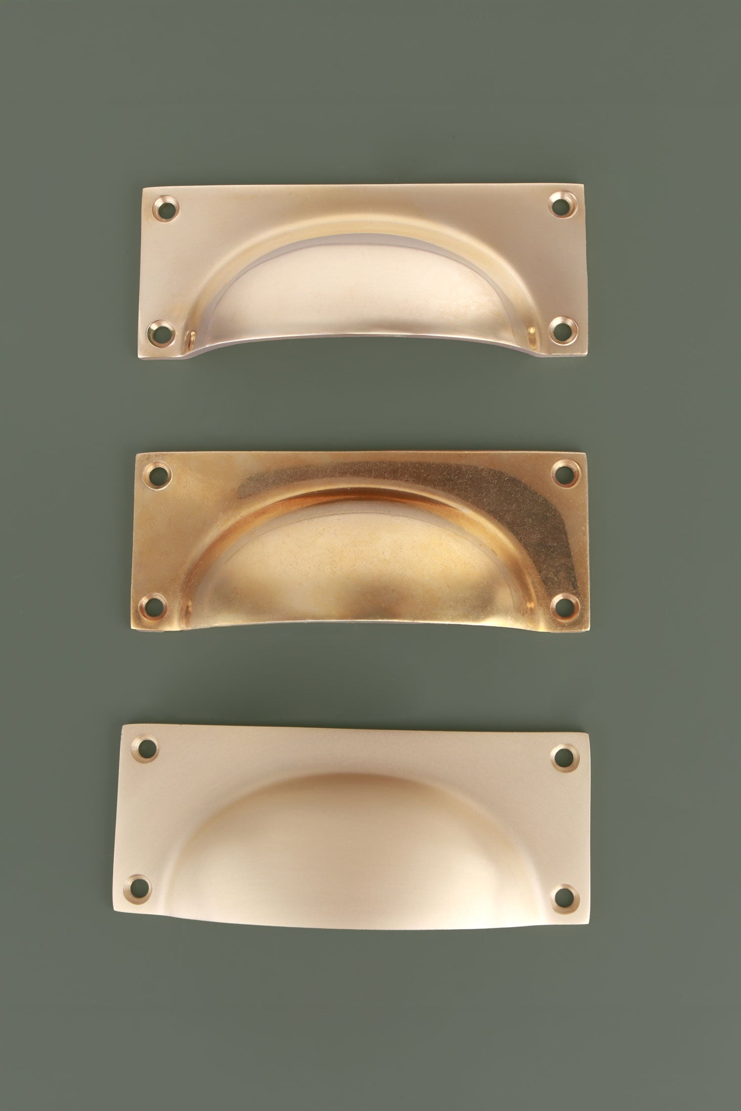 Bevelled Plate cup pulls grouped, showing the chamfered edge