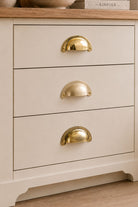 Three finishes of the Slim Crescent cup pull side by side