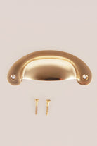 Slim Crescent cup pull in polished brass, unlacquered living finish