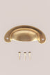 Slim Crescent cup pull in aged brass, unlacquered living finish