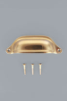 Deep Scoop cup pull in polished brass, unlacquered living finish