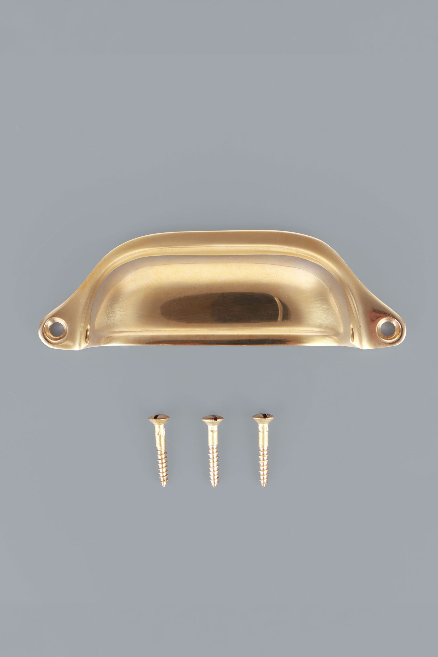 Deep Scoop cup pull in polished brass, unlacquered living finish