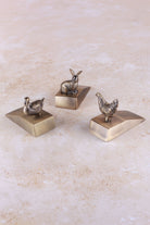 The three Homestead animal door stoppers together, antique brass