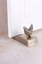 Hen door stopper in antique brass