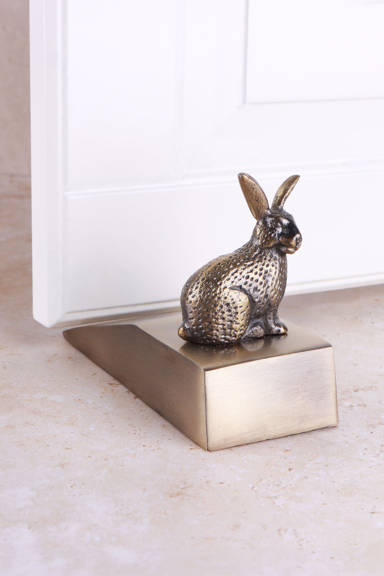 Rabbit door stopper in antique brass
