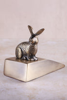 Rabbit door stopper in antique brass, side view