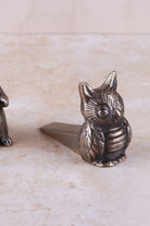 Owl door stopper in antique brass, side view