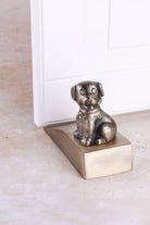 Dog door stopper in antique brass