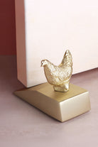 Hen door stopper in polished brass