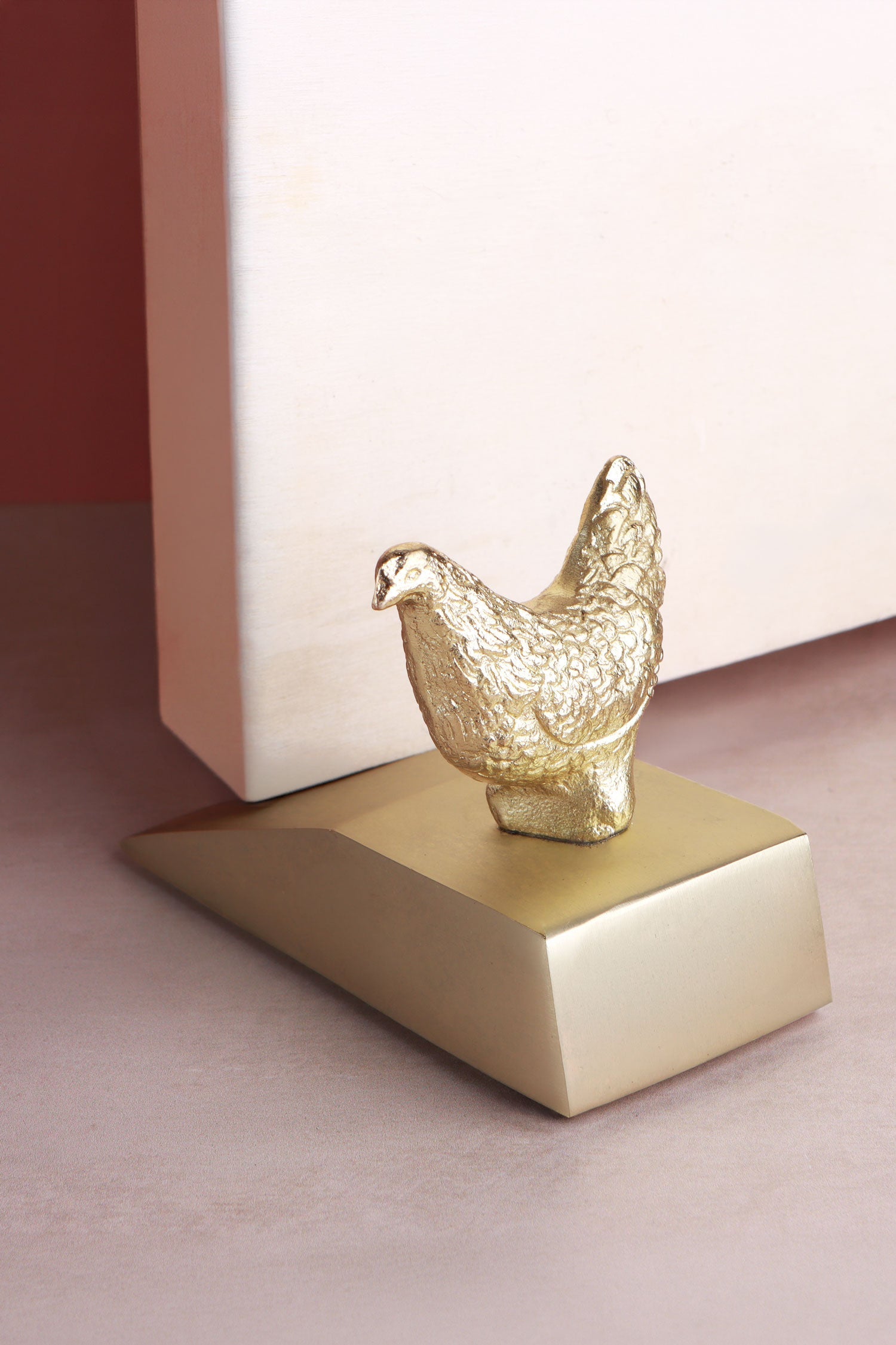 Hen door stopper in polished brass