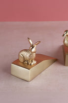 Rabbit door stopper in polished brass